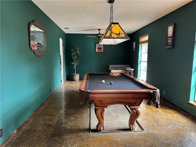 game room with ceiling fan, billiards, and a textured ceiling