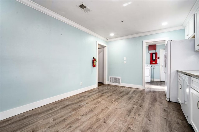 17714 Horseneck Rd, Bay Minette, AL 36507 - kitchen with white cabinetry, ornamental molding, washer / clothes dryer, and visible vents
