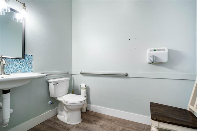 17714 Horseneck Rd, Bay Minette, AL 36507 - half bath featuring toilet, wood finished floors, and baseboards