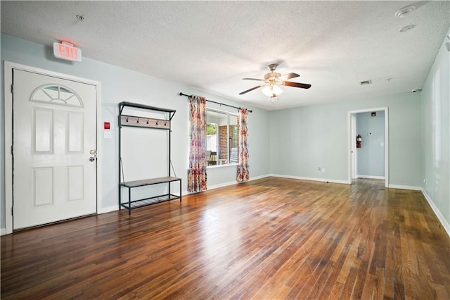 17714 Horseneck Rd, Bay Minette, AL 36507 - unfurnished living room with a ceiling fan, a textured ceiling, baseboards, visible vents, and wood finished floors