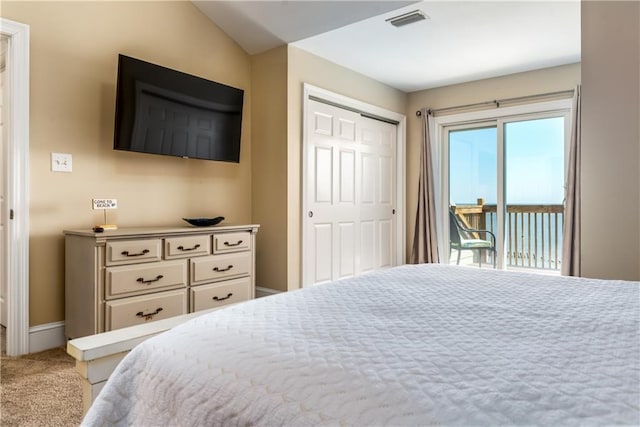 carpeted bedroom featuring access to exterior and a closet