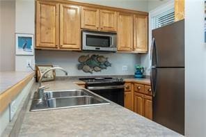 kitchen featuring appliances with stainless steel finishes and sink