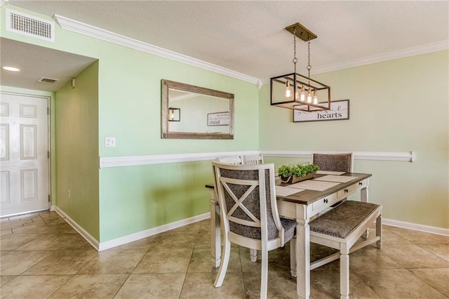 dining room featuring a textured ceiling, light tile patterned floors, crown molding, and an inviting chandelier