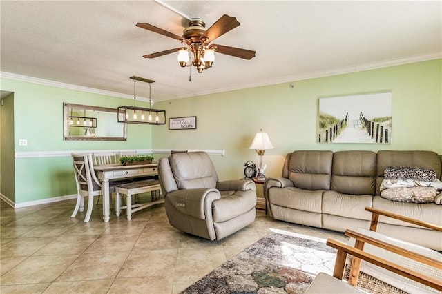 living room featuring ceiling fan, ornamental molding, and light tile patterned floors