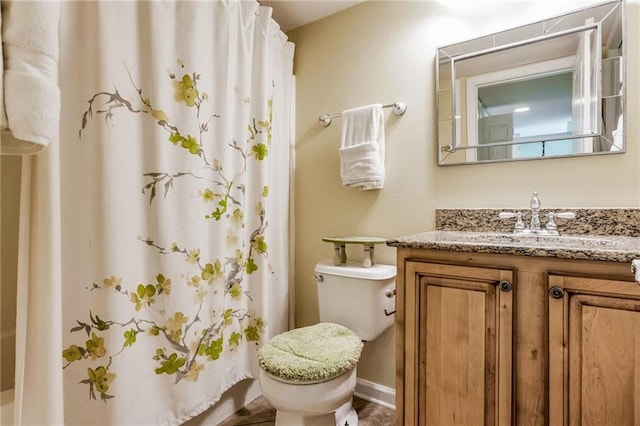 full bathroom with vanity, shower / bath combination with curtain, and toilet