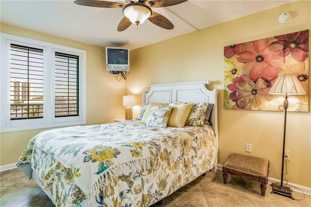 bedroom featuring tile patterned floors and ceiling fan