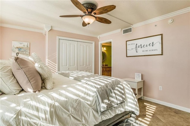 tiled bedroom featuring a closet, ornamental molding, and ceiling fan