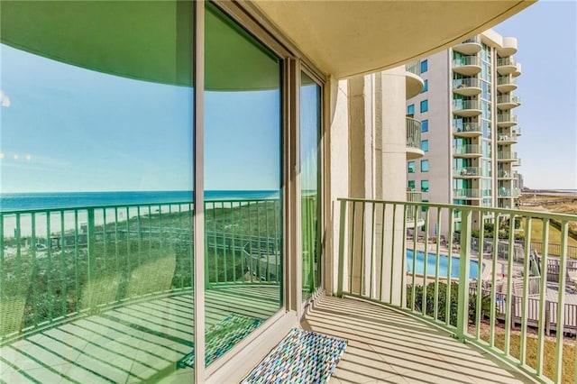 balcony featuring a water view