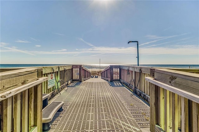 view of home's community with a beach view and a water view