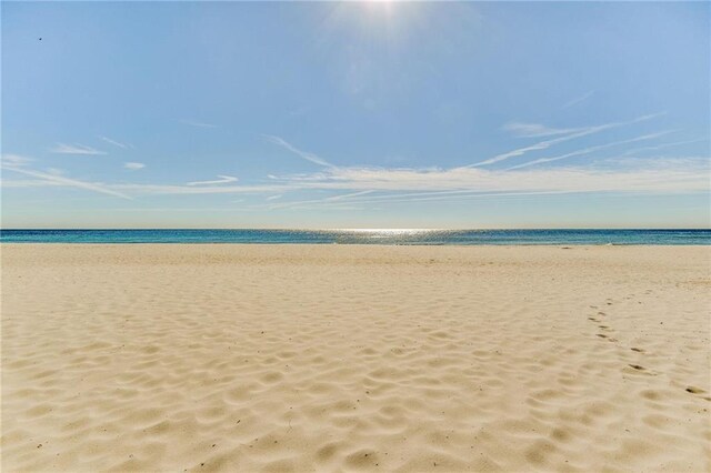 property view of water featuring a beach view