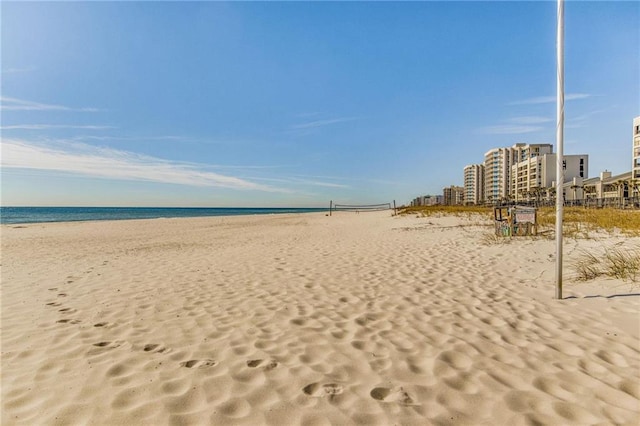 view of community featuring a water view and a view of the beach