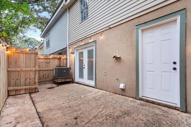 view of patio / terrace featuring french doors and central air condition unit