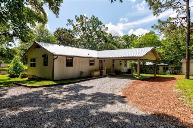 11375 Wacker Dr, Theodore, AL 36582 - view of front of house featuring driveway, a carport, and a metal roof