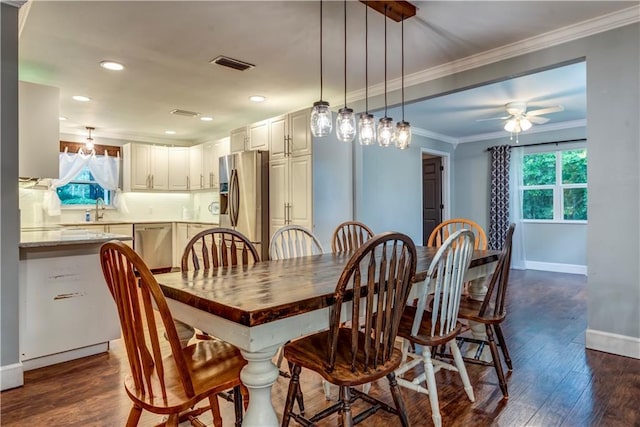 11375 Wacker Dr, Theodore, AL 36582 - dining room with healthy amount of natural light, dark wood-style flooring, crown molding, a ceiling fan, and recessed lighting