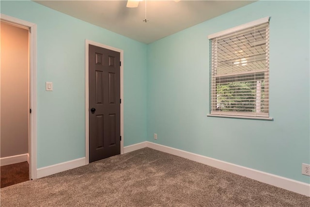 11375 Wacker Dr, Theodore, AL 36582 - spare room with dark carpet and a ceiling fan