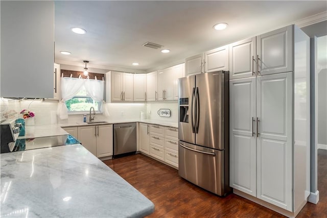 11375 Wacker Dr, Theodore, AL 36582 - kitchen featuring stainless steel appliances, tasteful backsplash, light stone countertops, dark wood-type flooring, and recessed lighting