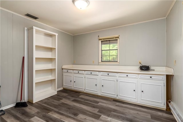11375 Wacker Dr, Theodore, AL 36582 - kitchen featuring white cabinets, crown molding, dark wood-style floors, light countertops, and a baseboard radiator