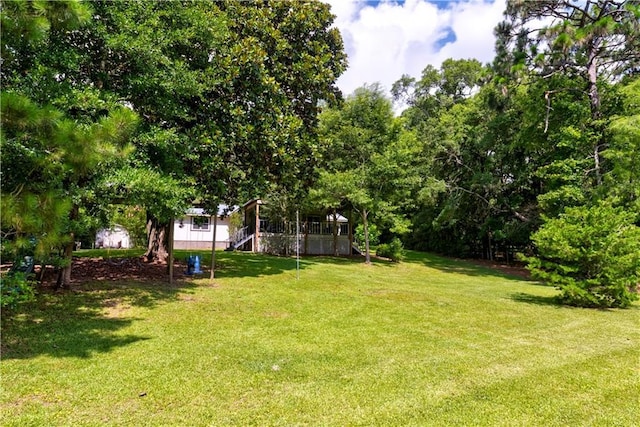 11375 Wacker Dr, Theodore, AL 36582 - view of grassy yard with stairway and a wooden deck