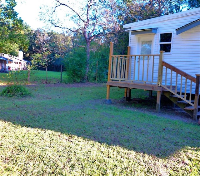 view of yard featuring a wooden deck