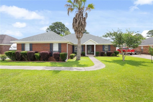 7115 Haleys Way, Theodore, AL 36582 - ranch-style home featuring a front lawn, brick siding, and a shingled roof