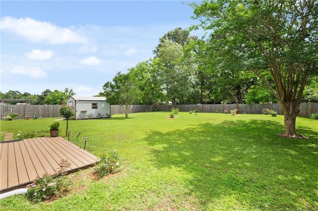 7115 Haleys Way, Theodore, AL 36582 - view of yard with a storage shed, a wooden deck, and an outdoor structure
