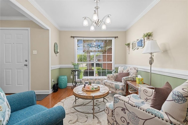 7115 Haleys Way, Theodore, AL 36582 - living area with wood finished floors, a chandelier, ornamental molding, and baseboards