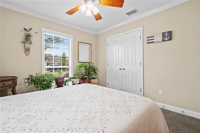 7115 Haleys Way, Theodore, AL 36582 - bedroom featuring carpet floors, ornamental molding, baseboards, ceiling fan, and a closet