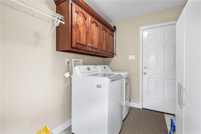 7115 Haleys Way, Theodore, AL 36582 - clothes washing area with washer and clothes dryer, cabinet space, baseboards, and light tile patterned floors
