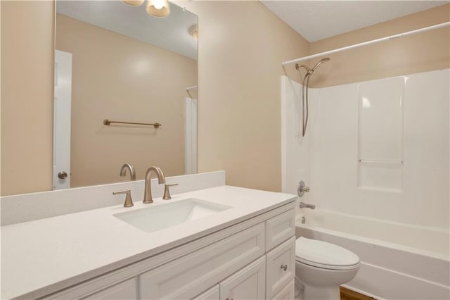 full bath with toilet, tub / shower combination, a textured ceiling, and vanity