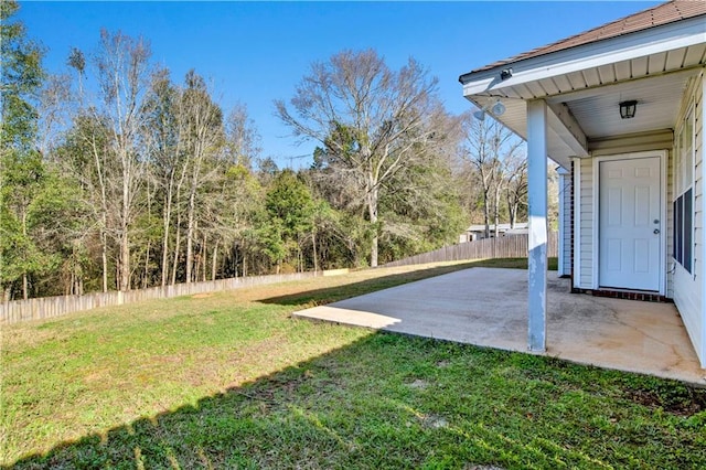 view of yard featuring a patio area and fence