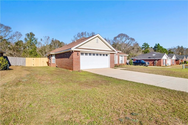 view of front of home with a garage, concrete driveway, fence, a front lawn, and brick siding