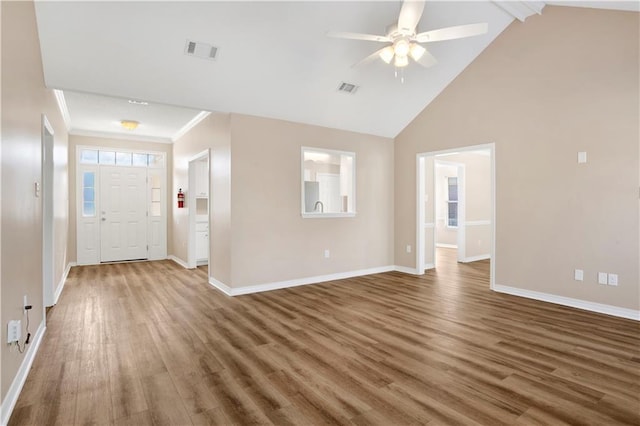 entryway with a ceiling fan, wood finished floors, visible vents, and baseboards