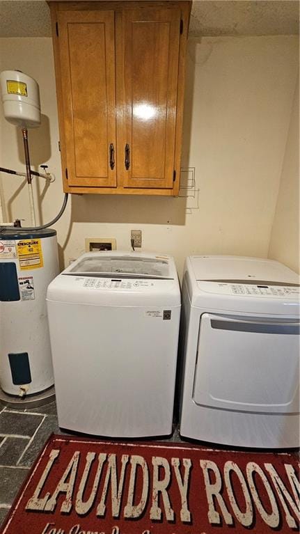 clothes washing area featuring washer hookup, electric water heater, separate washer and dryer, and cabinets