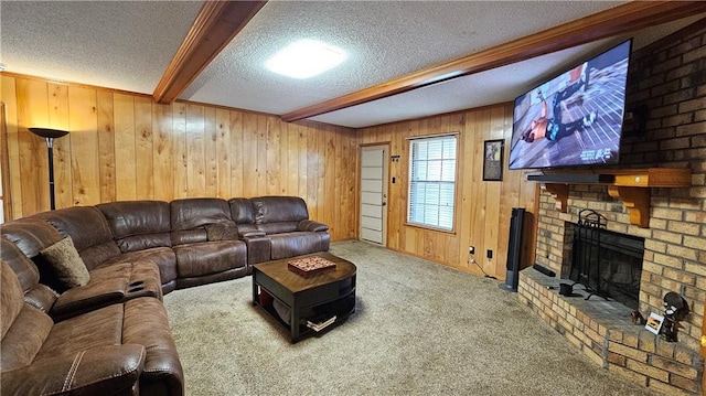 carpeted living room with a fireplace, brick wall, a textured ceiling, beamed ceiling, and wooden walls