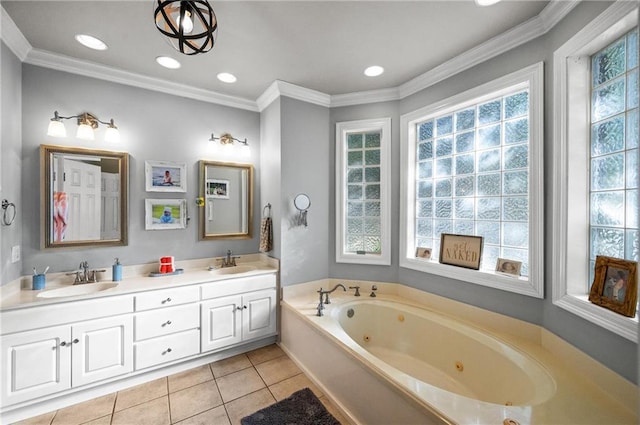 bathroom featuring vanity, tile patterned floors, a bathing tub, and ornamental molding