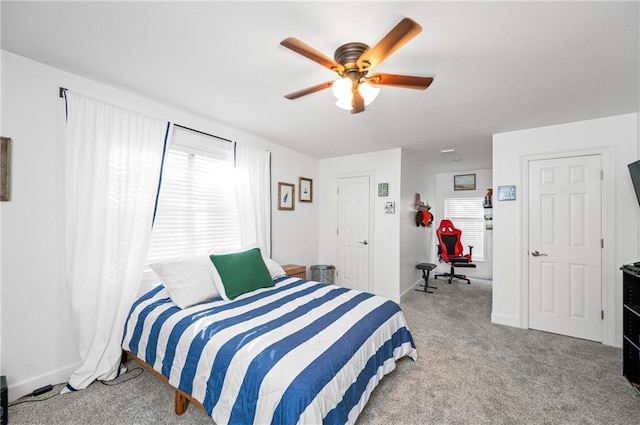 carpeted bedroom with ceiling fan