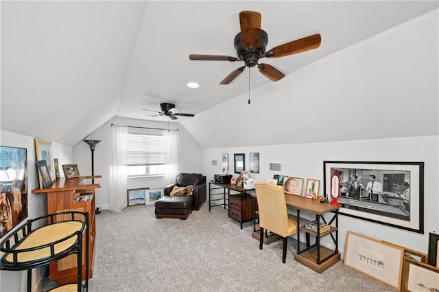 carpeted office space with ceiling fan and vaulted ceiling