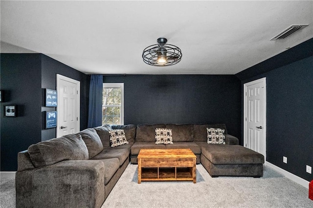 living room featuring ceiling fan and light colored carpet