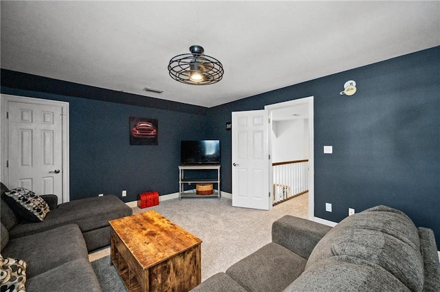 living room with carpet floors and ceiling fan