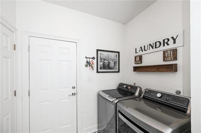 laundry area featuring washing machine and clothes dryer