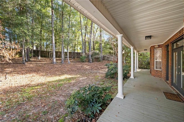 view of yard featuring covered porch