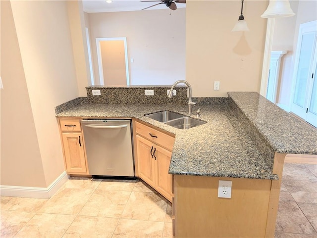 kitchen with light brown cabinets, a sink, decorative light fixtures, and dishwasher