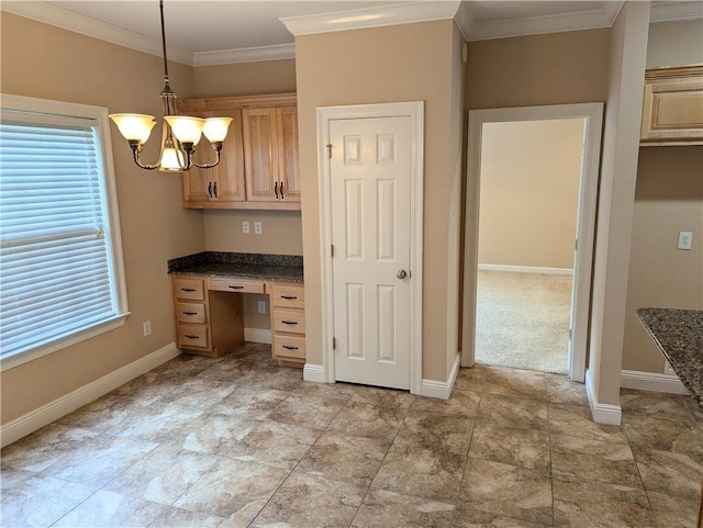 kitchen with baseboards, built in study area, ornamental molding, hanging light fixtures, and light brown cabinets