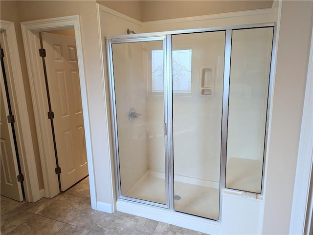 bathroom featuring a shower stall and tile patterned floors