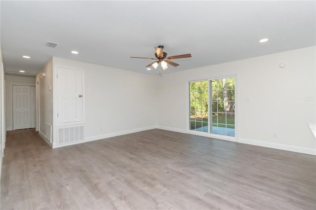 empty room featuring light hardwood / wood-style floors and ceiling fan