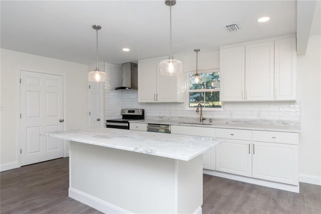 kitchen with white cabinetry, wall chimney exhaust hood, stainless steel appliances, and sink