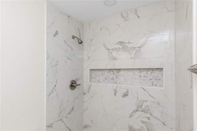 bathroom featuring tiled shower