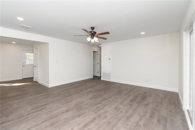 unfurnished room featuring hardwood / wood-style flooring and ceiling fan