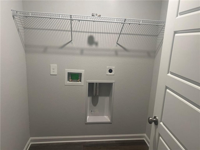 washroom with hookup for a washing machine, hookup for an electric dryer, and dark hardwood / wood-style floors