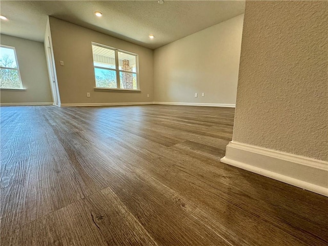 unfurnished room featuring plenty of natural light